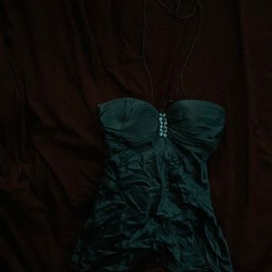 Teal shirt with rhinestones and a string that ties around the neck